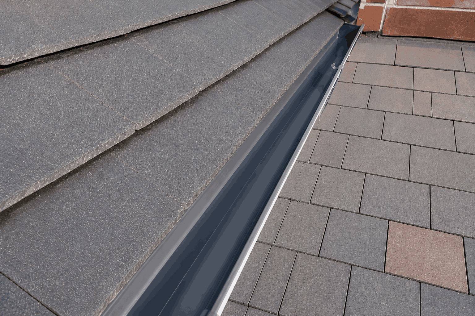 Cleaned gutter channel after vacuum extraction of weeds, silt and roots in Birmingham