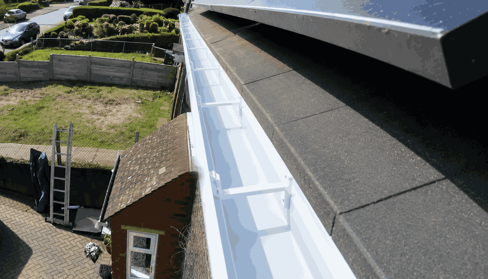 Clear, free-flowing gutter channel after vacuum cleaning